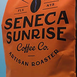Seneca Sunrise Coffee Co. coffee bag on a blue background