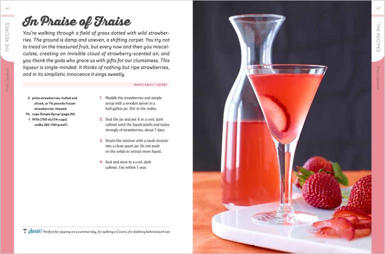 Page out of a book. Strawberry-themed cocktail with a glass and carafe on a table, accompanied by strawberries.