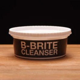 Brite Cleanser container on a wooden surface with a black background