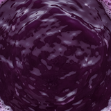 Close-up of dark purple liquid with swirling patterns