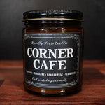 Candle jar labeled 'Corner Cafe' on a wooden surface with a dark background