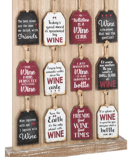 Decorative wall art with wine-themed sayings on wooden tags.