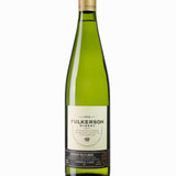 Green bottle of Fulkerson‘s gruner veltliner With a gold cap on a white background