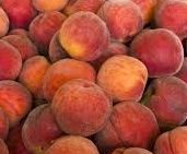 Close-up of a pile of peaches with a soft focus