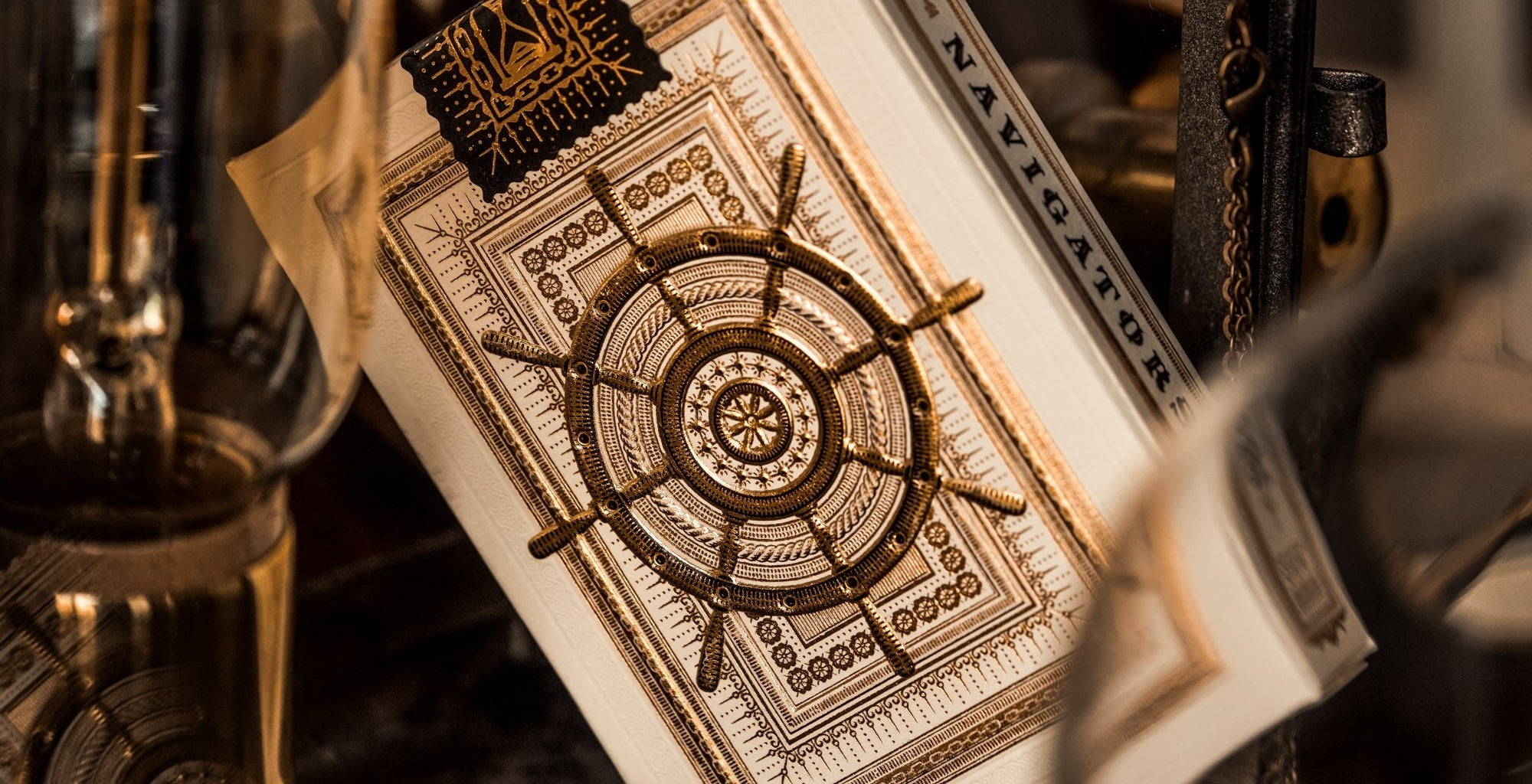 Decorative card with a ship's wheel design in a vintage setting