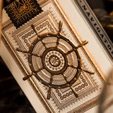 Decorative card with a ship's wheel design in a vintage setting