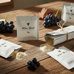 Wine yeast packages on a wooden table with grapes and corks. AI generated image.
