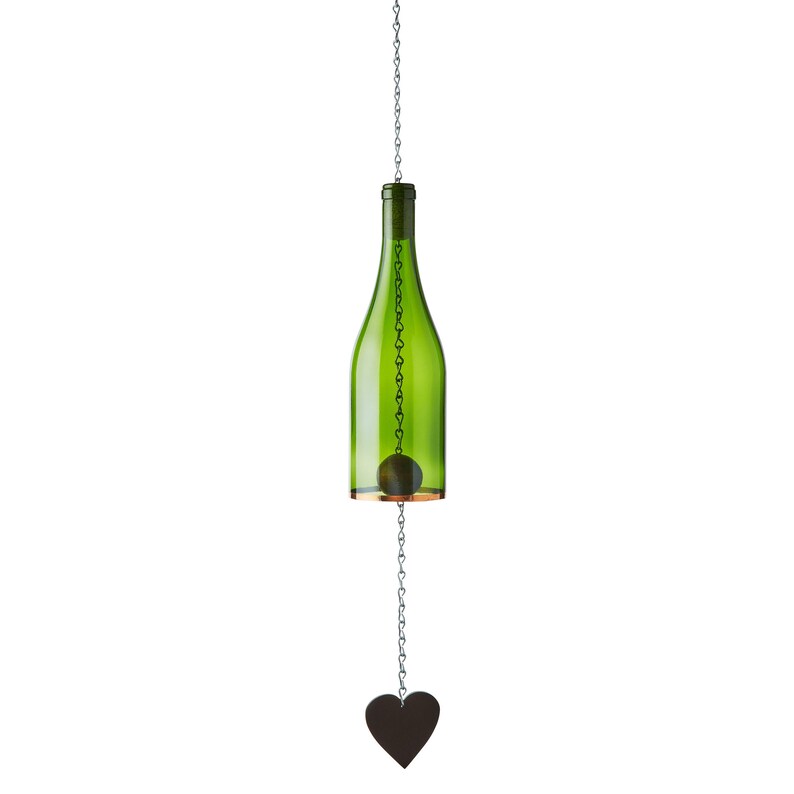 Green glass bottle hanging from a chain with a heart-shaped object at the bottom on a white background