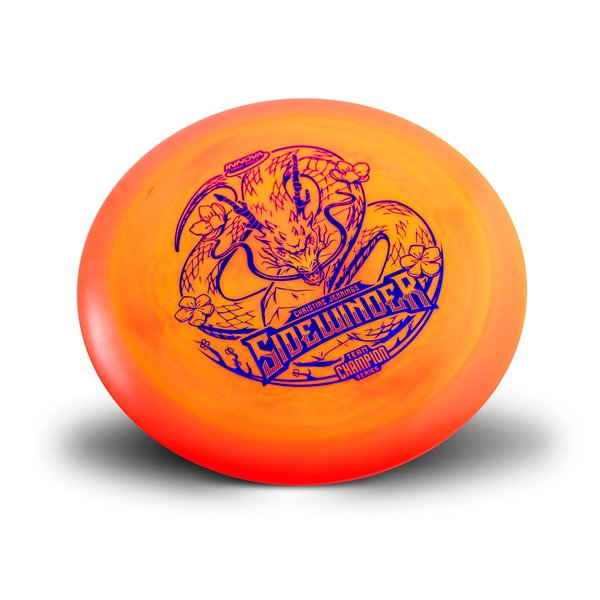 Orange disc golf disc with sidewinder branding and a snake image on a white background