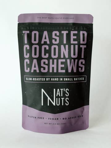 Package of toasted coconut cashews by Nat's Nuts on a white background