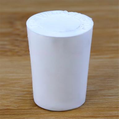 Solid rubber stopper on a wooden background