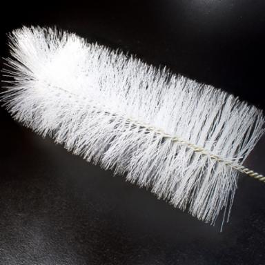 White bristle brush on a black background