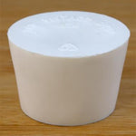 Solid rubber stopper on a wooden background