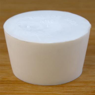 Solid rubber stopper on a wooden background