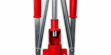 Red and silver corking tool on a white background