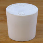 Solid rubber stopper on a wooden background