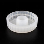 Clear plastic cap on a black background
