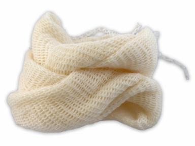 White knitted muslin bag wound up on a white background