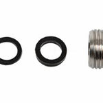 Set of metal washer, O-ring, and metal fitting on a white background