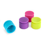 Four colorful silicone cups on a white background